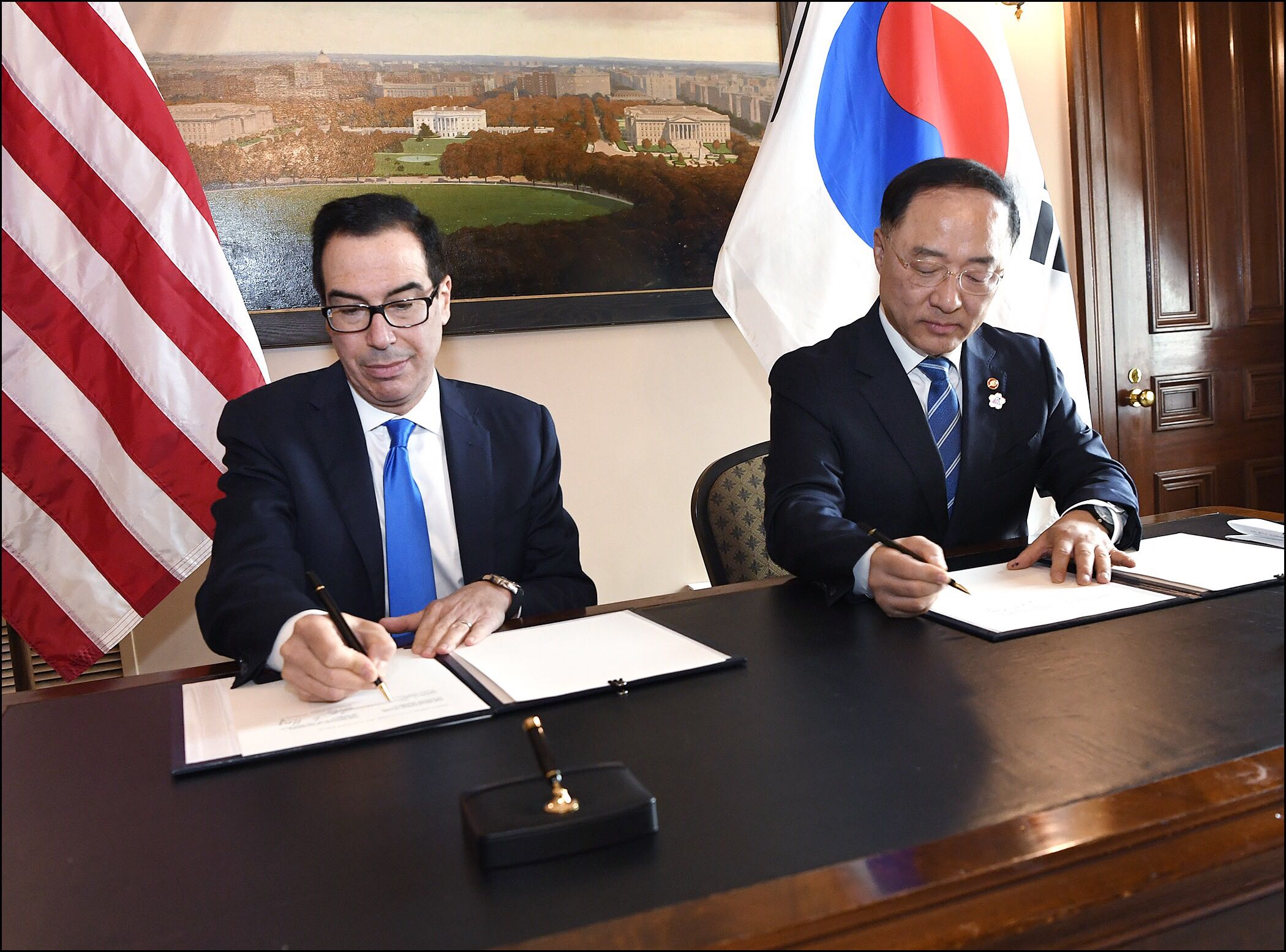 U.S. Secretary of the Treasury Steven T. Mnuchin and Korean Deputy Prime Minister and Finance Minister Hong Nam-ki sign a Memorandum of Understanding to Strengthen Infrastructure Finance and Market Building Cooperation. Photo credit: U.S. Department of the Treasury, October 17, 2019
